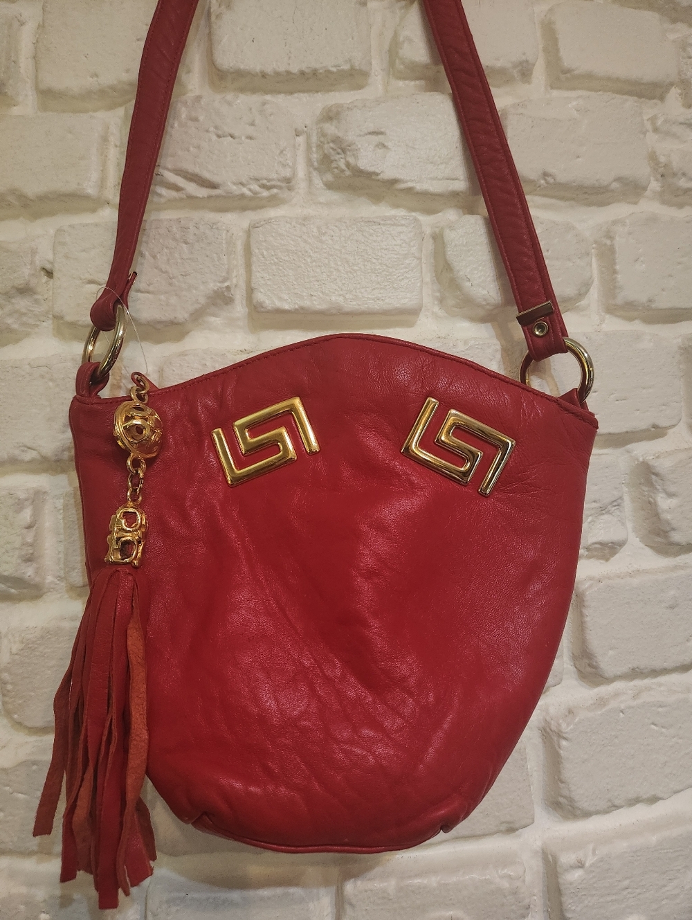 Vintage 80s Red Leather Crossbody Mini Bucket Bag with Gold Tassel Hardware